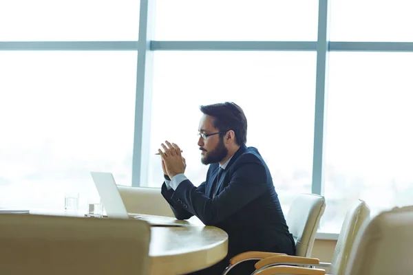 Modern specialist sitting by workplace — Stock Photo, Image