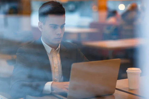 Business professional sitting in cafe — Stock Photo, Image