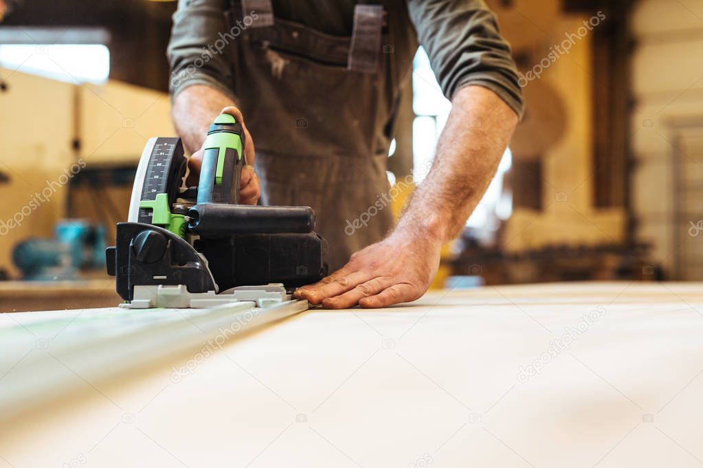 Carpenter using scroll-saw 
