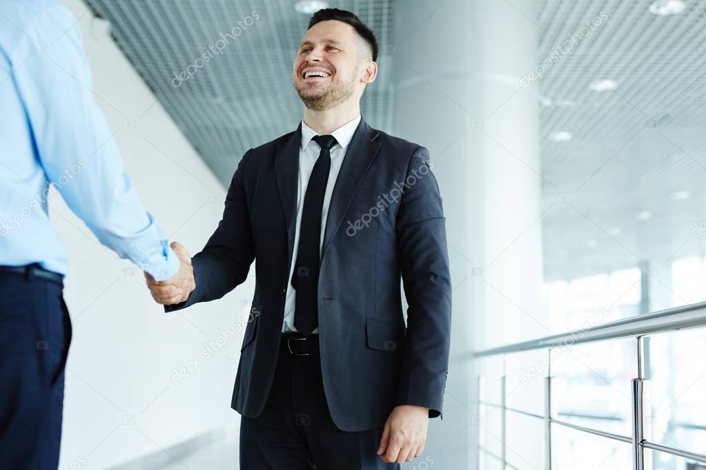 business leader greeting new employee