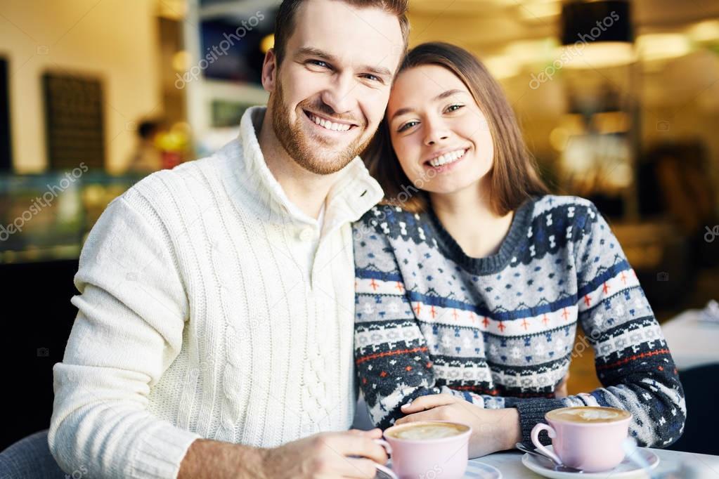 Happy couple having cappuccino 