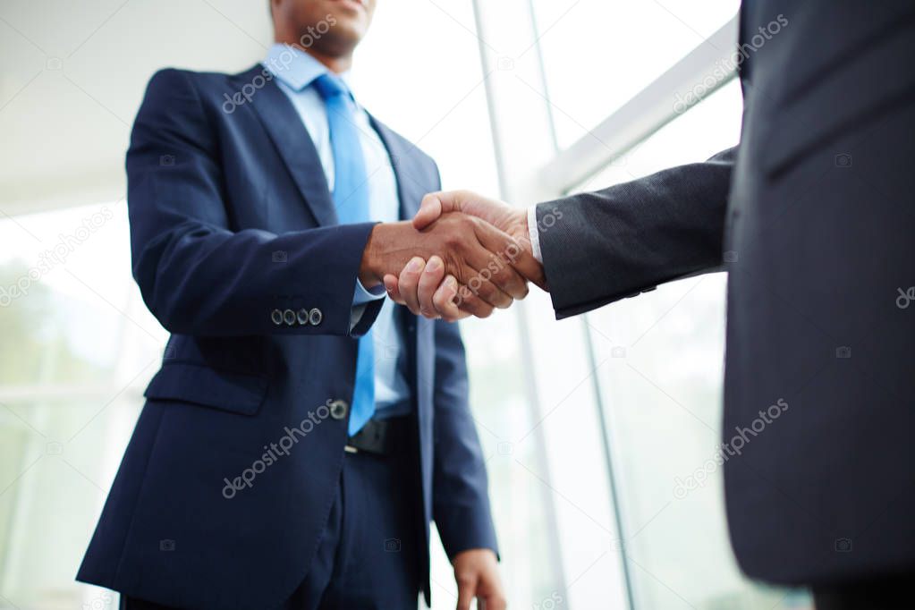 businessmen handshaking after making deal