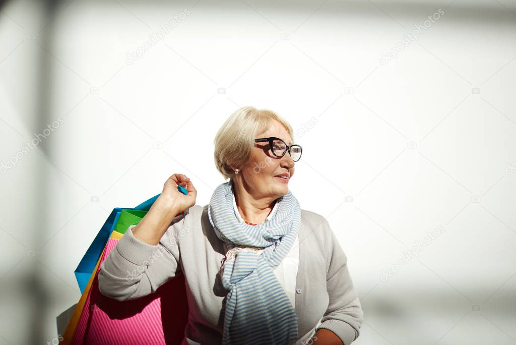Aged shopper with paperbags