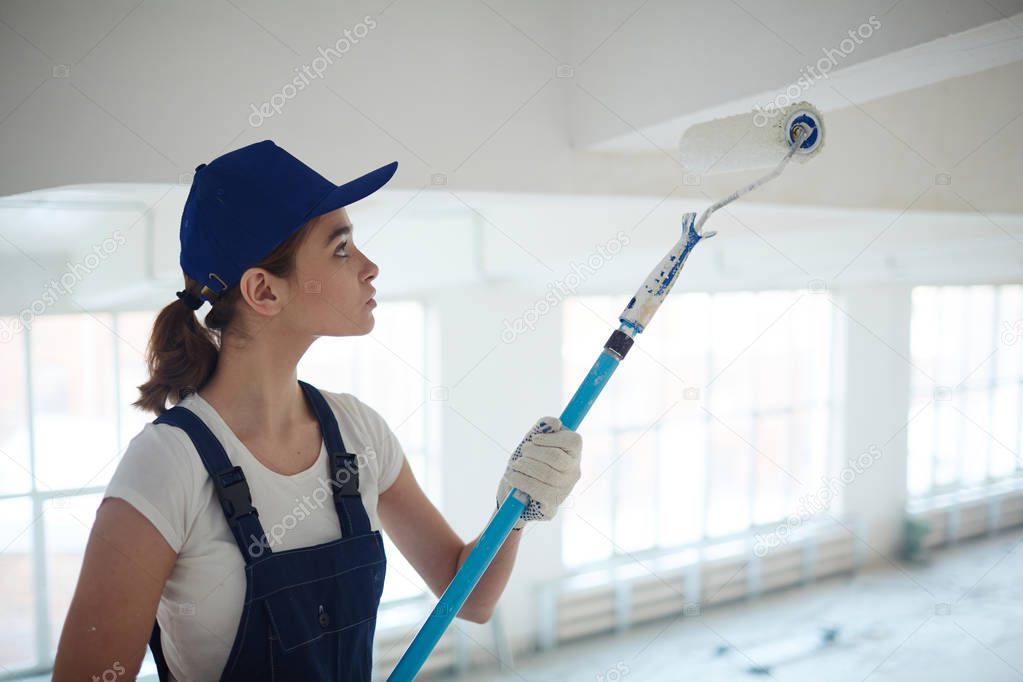 painter restoring ceiling