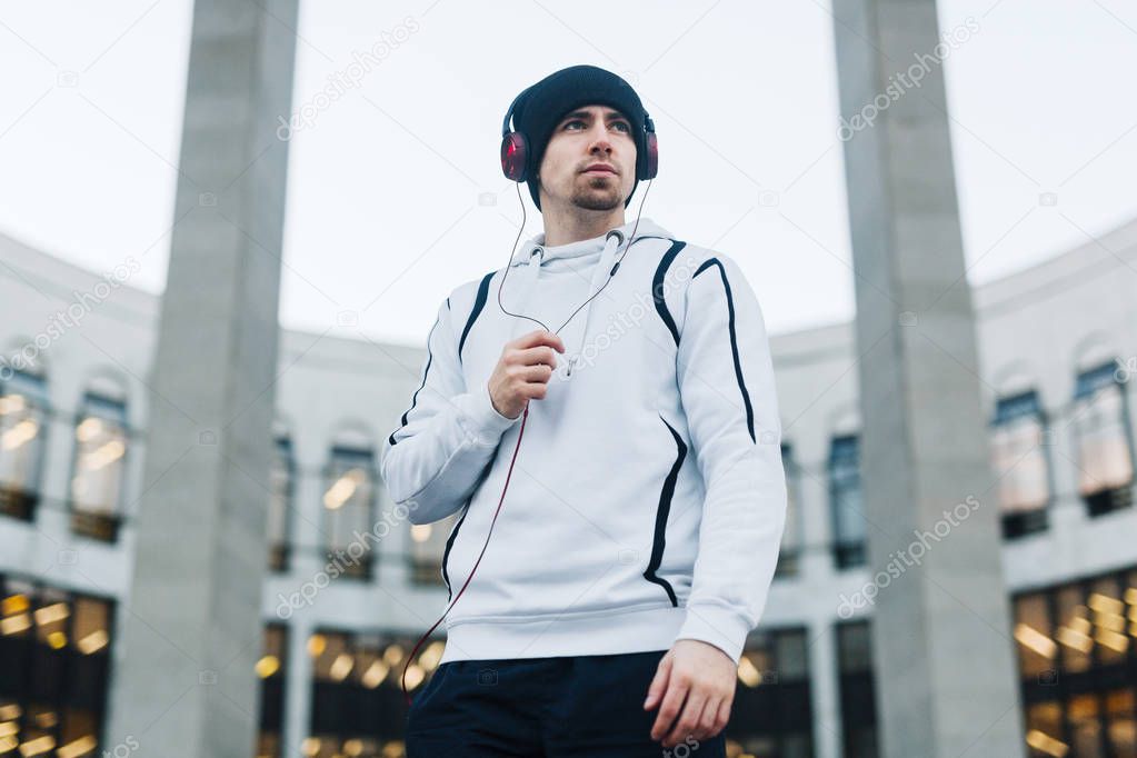 Young sportsman in headphones