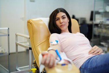Pretty girl transfusing her blood clipart