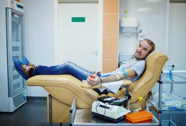 donor of blood sitting in armchair clipart