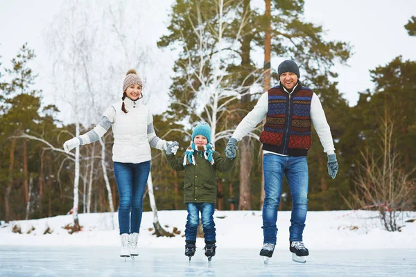 Active family skating — Stock Photo, Image