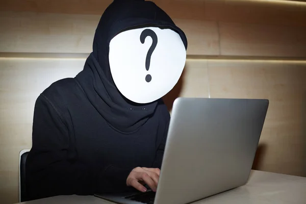 Hacker in black hoodie — Stock Photo, Image