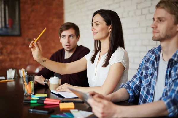 Woman raising hand — Stock Photo, Image