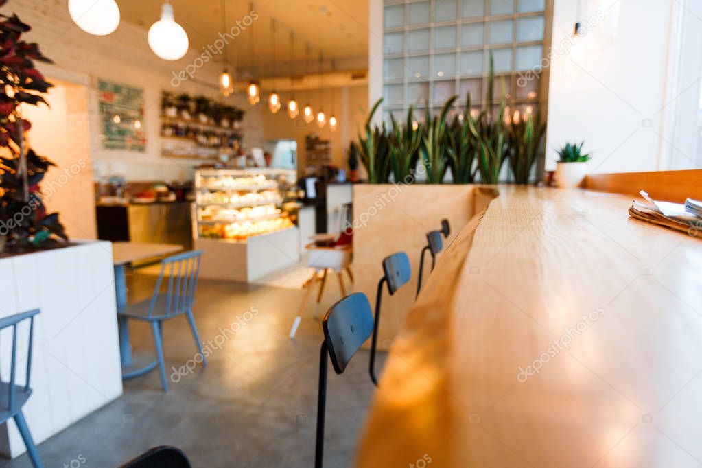 empty tables and chairs in bakery store