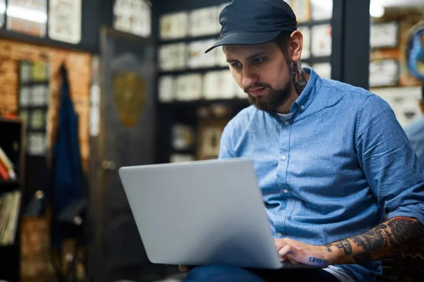 Stylish young man with laptop — Stock Photo, Image