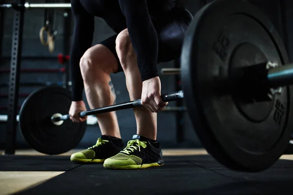 Male athlete lifting huge barbell — Stock Photo, Image