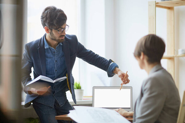 manager helping female colleague