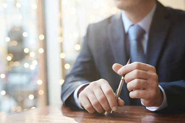 Businessman holding pen — Stock Photo, Image