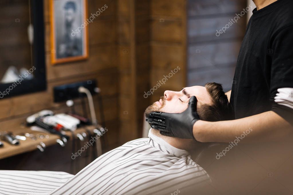 Barber preparing his client — Stock Photo © pressmaster 144855401