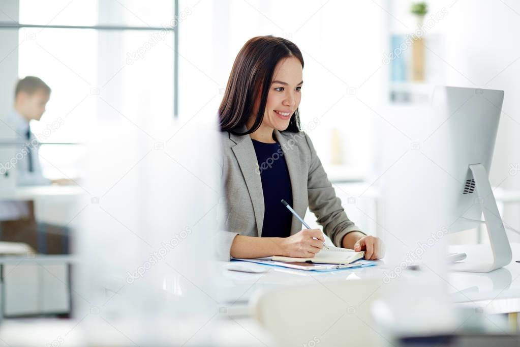 Confident Businesswoman at Workplace