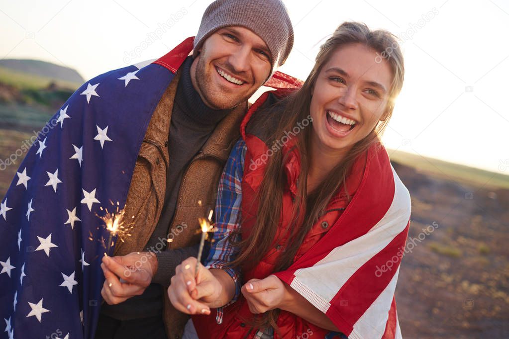 Couple wrapped in American flag