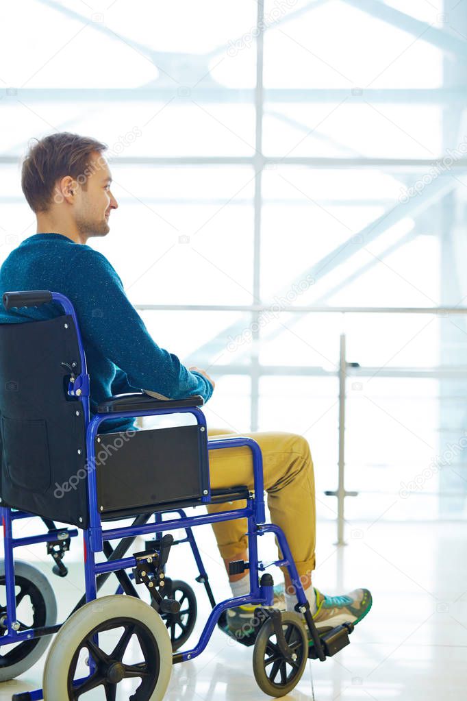 man sitting in wheelchair