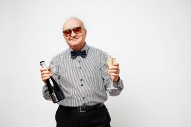 senior man in sunglasses holding champagne  clipart