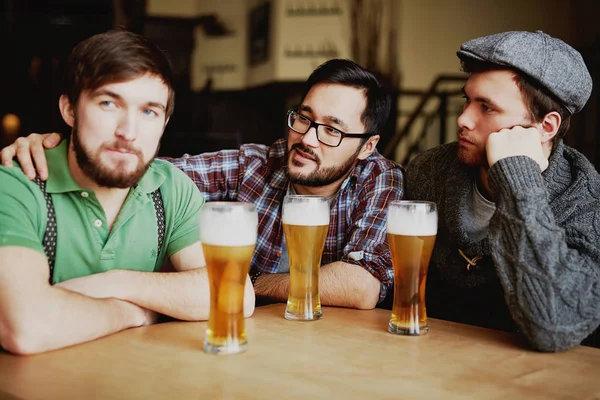 Three men in Bar with beer — Stock Photo, Image