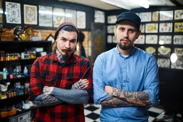 Stylish guys in tattoo salon — Stock Photo, Image