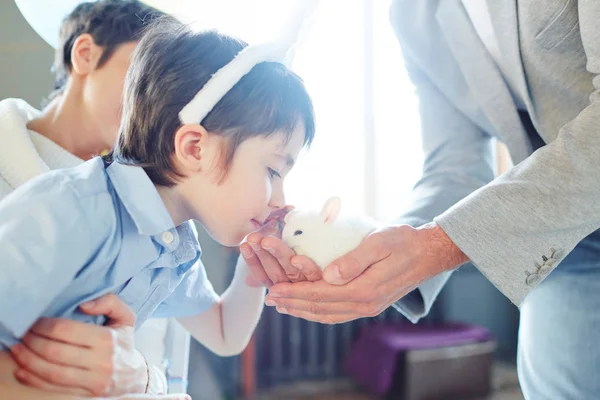 Boy bending towards fluffy — Stock Photo, Image