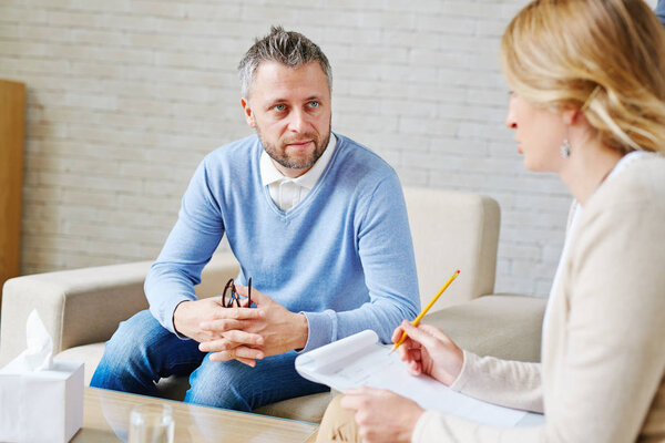 psychiatrist holding clipboard and pencil