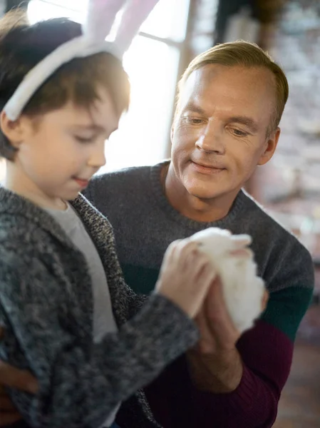 Boy cuddling Easter rabbit — Stock Photo, Image