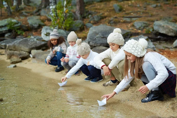 Children playing with paper boats — Stock Photo, Image