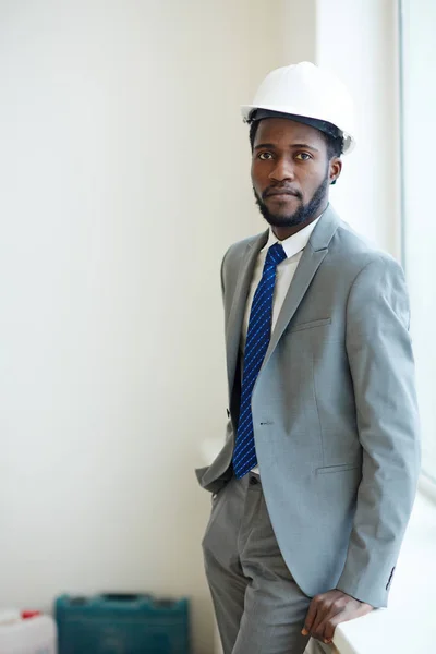 Foreman standing by window — Stock Photo, Image