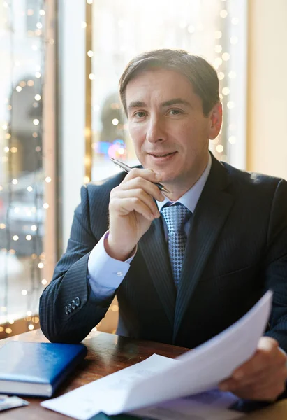 Confident businessman in cafe — Stock Photo, Image