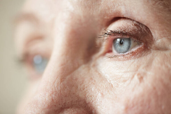 Sad eyes of elderly woman