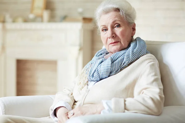 Retired woman looking at camera — Stock Photo, Image