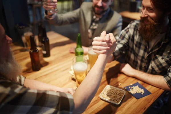 Young and senior men having wrestling — Stock Photo, Image