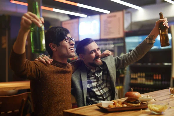 Ecstatic men with beer — Stock Photo, Image