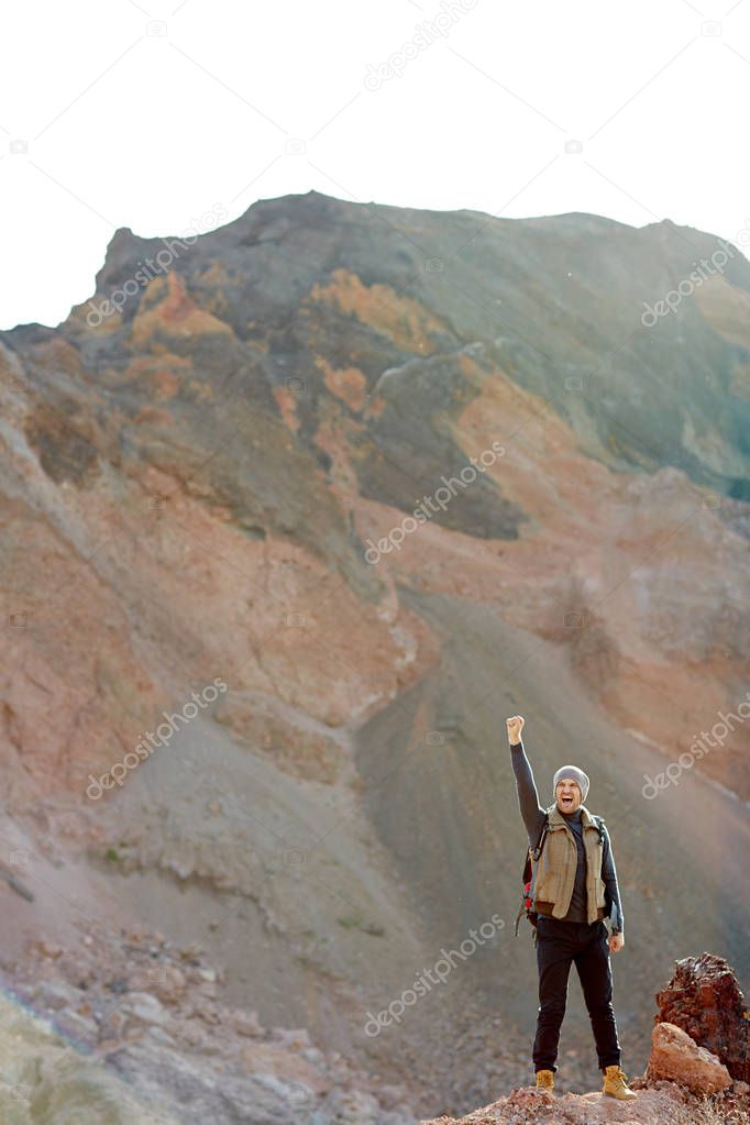 Traveler standing on top of peak 