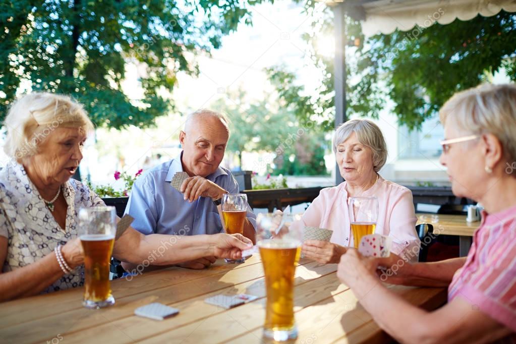 elderly people relaxing in cafe