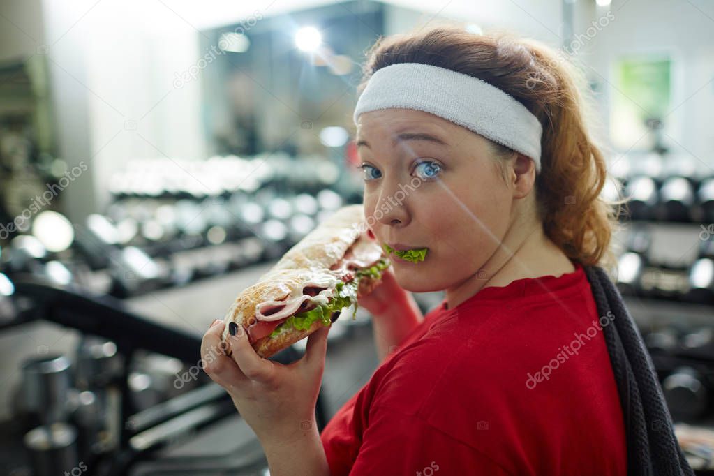 woman eating huge sandwich