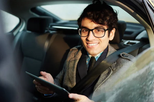 Portrait Confident Middle Eastern Businessman Riding Backseat Car Using Tablet — Stock Photo, Image