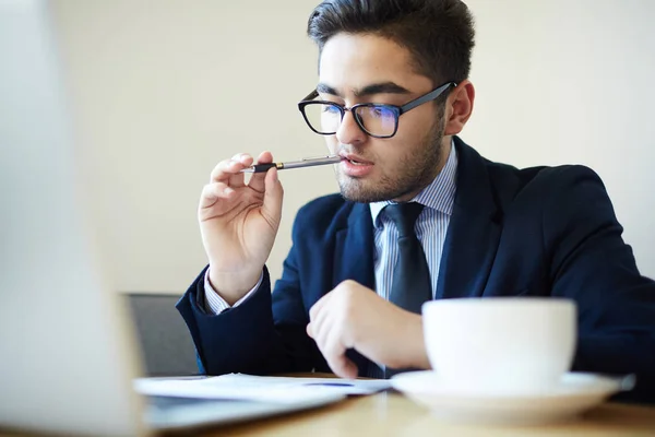 Financial Director Contemplating Pen Mouth While Reading Document Contract — Stock Photo, Image