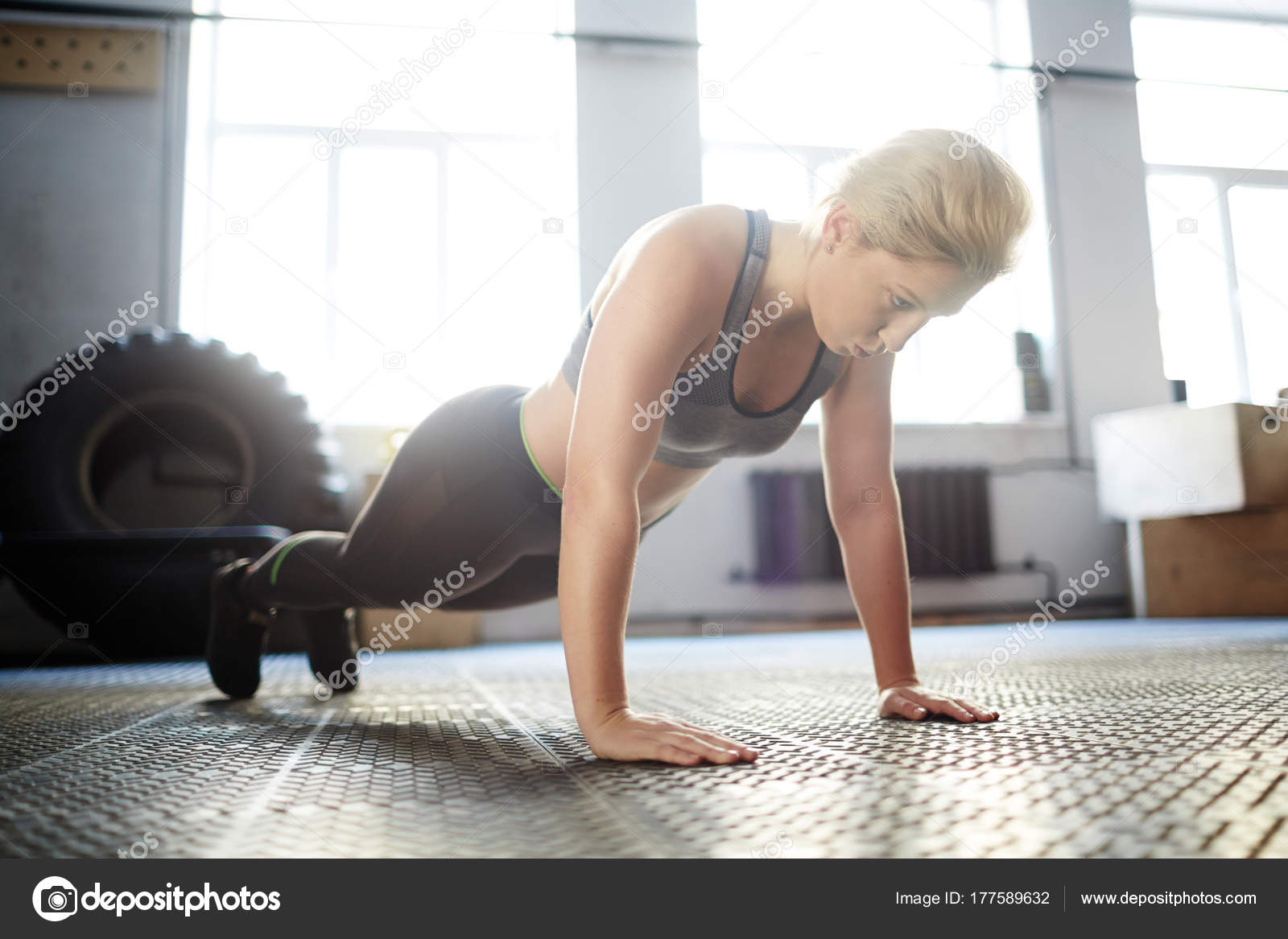 Attractive Young Woman Wrapped Fitness Training She Doing Plank Exercise Stock Photo C Pressmaster
