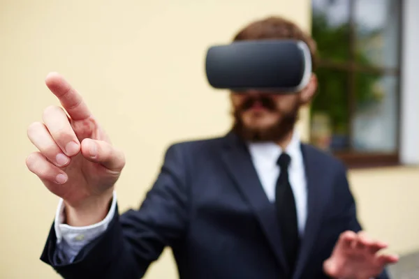 Businessman Augmented Reality Headset Touching Imaginary Button Start Game — Stock Photo, Image