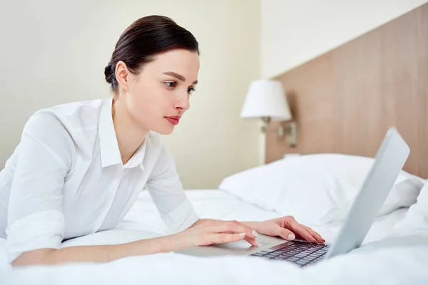 Busy Female Lying Bed Networking — Stock Photo, Image