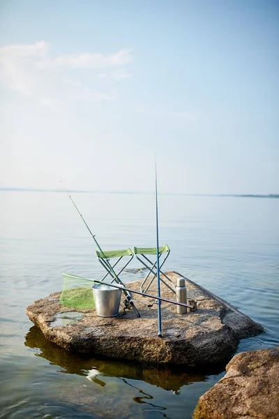 Image Two Empty Seats Fishing Rods Gear Rock Island Still — Stock Photo, Image