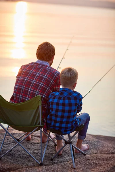 Back View Portrait Father Son Sitting Together Rocks Fishing Rods — Stock Photo, Image