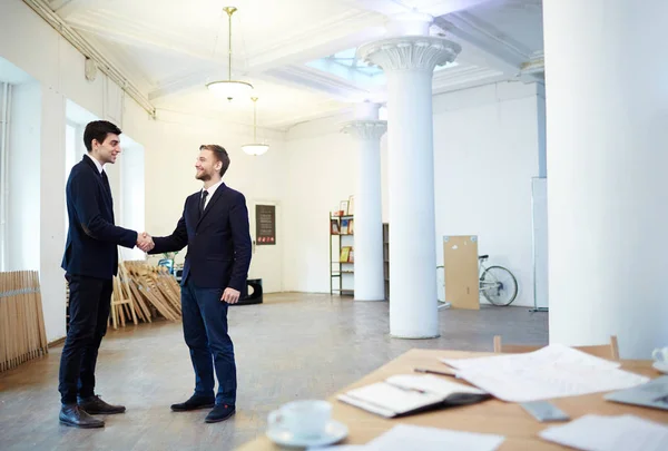 Young Business Partners Greeting One Another Handshake — Stock Photo, Image