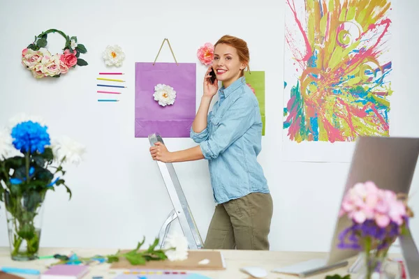 Cheerful Floral Designer Denim Shirt Standing Stepladder White Wall Decorated — Stock Photo, Image