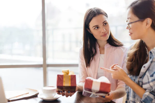 Young Businesswoman Holding Two Gifts While Her Colleague Choosing One — Stock Photo, Image
