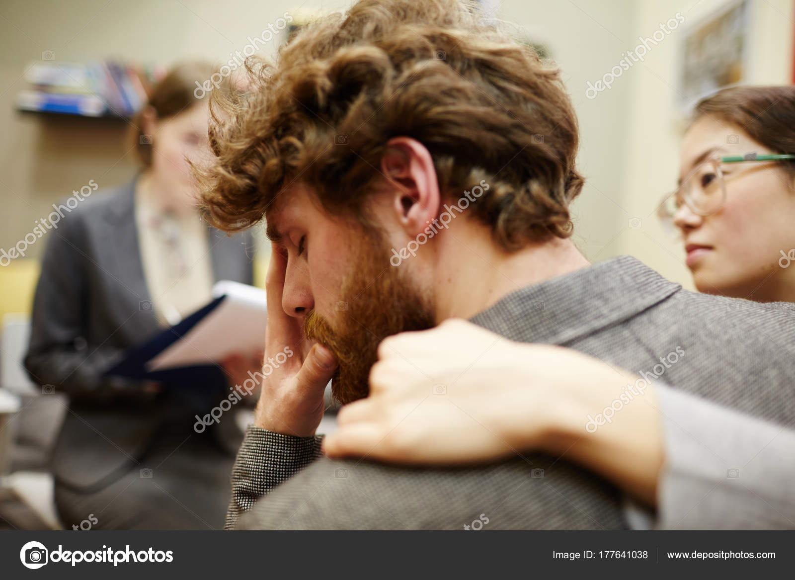 Portrait Young Man Crying Couples Counseling Session Wife Hugging